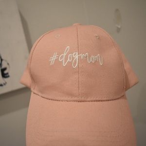 Pink “#dog mom” baseball cap.